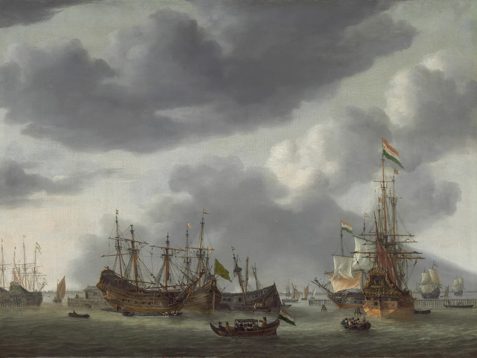 Reinier Nooms, called Zeeman, Amsterdam Harbor Scene, c. 1654/1655, oil on canvas: Dutch East India Company ships at anchor under a stormy sky, with laden rowing boats crossing the harbour.